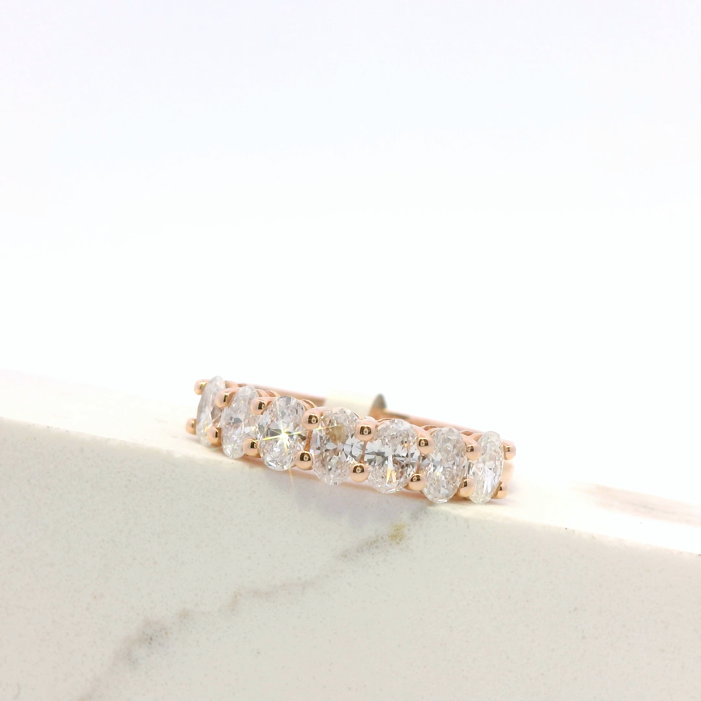Celine half-eternity oval diamond ring, side view, rose gold, Luma Jewellery