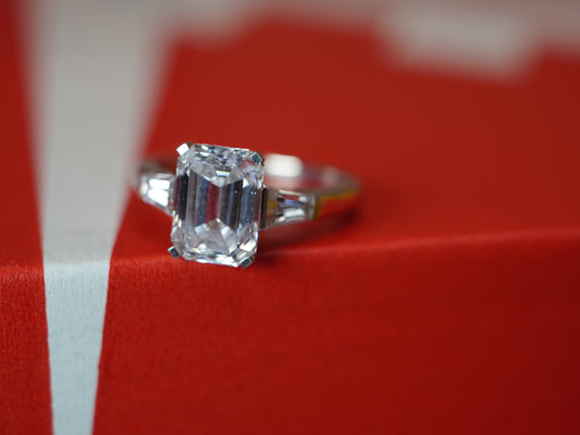 A raw lab grown diamond beside a finished Luma diamond ring, Luma Jewellery