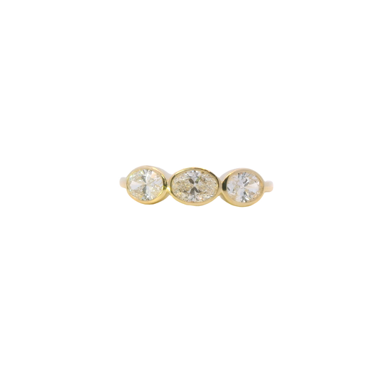 Gold earrings with three marquise diamonds on a white background