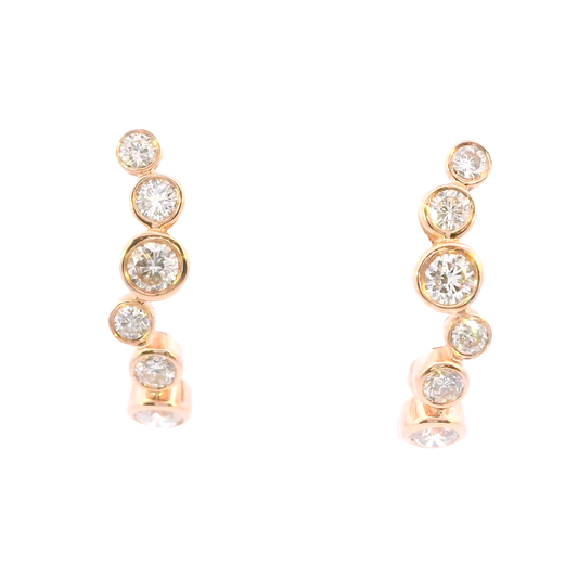 Pair of rose gold earrings with clear gemstones on a white background