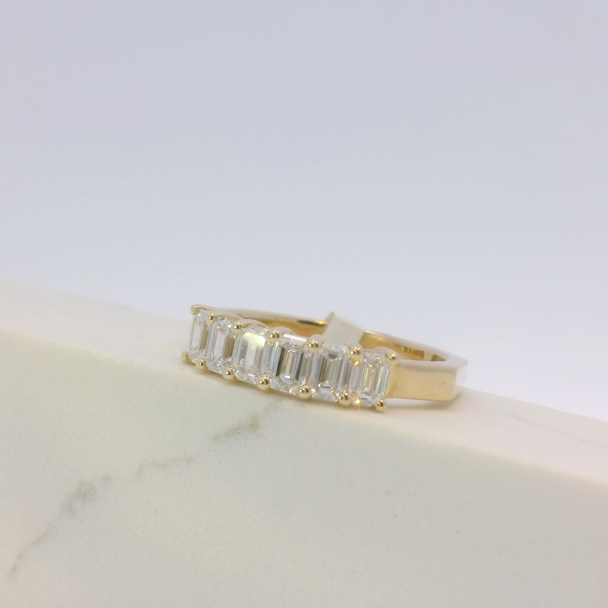 Cassiane emerald cut diamond ring, side view, Luma Jewellery