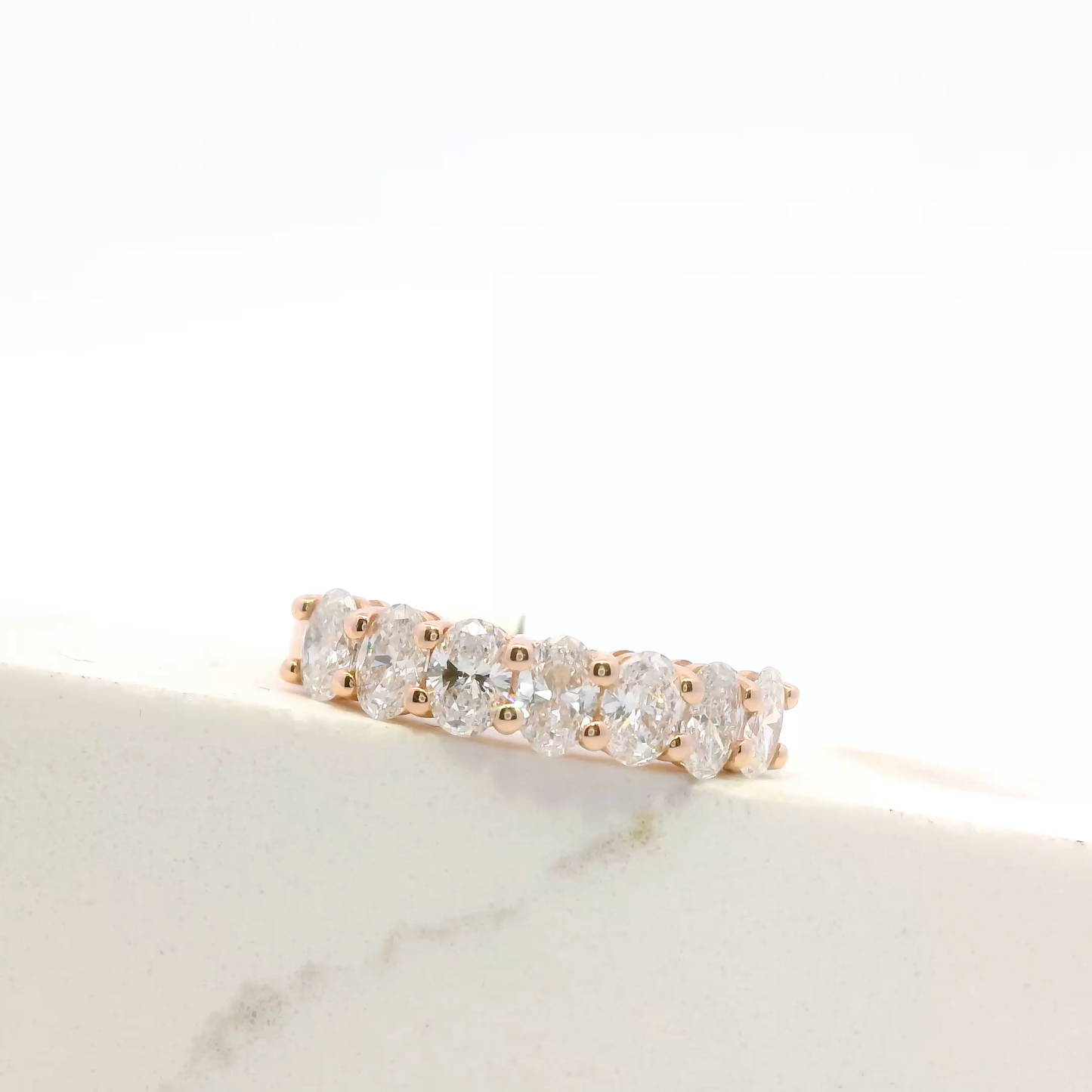 Celine oval diamond half-eternity ring, rose gold, Luma Jewellery