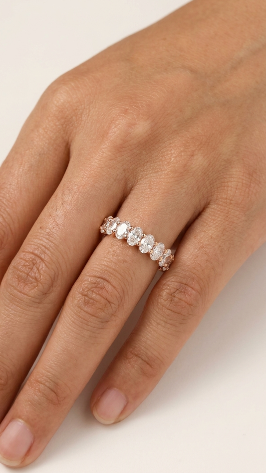 Celine rose gold half eternity ring worn on the finger, Luma Jewellery