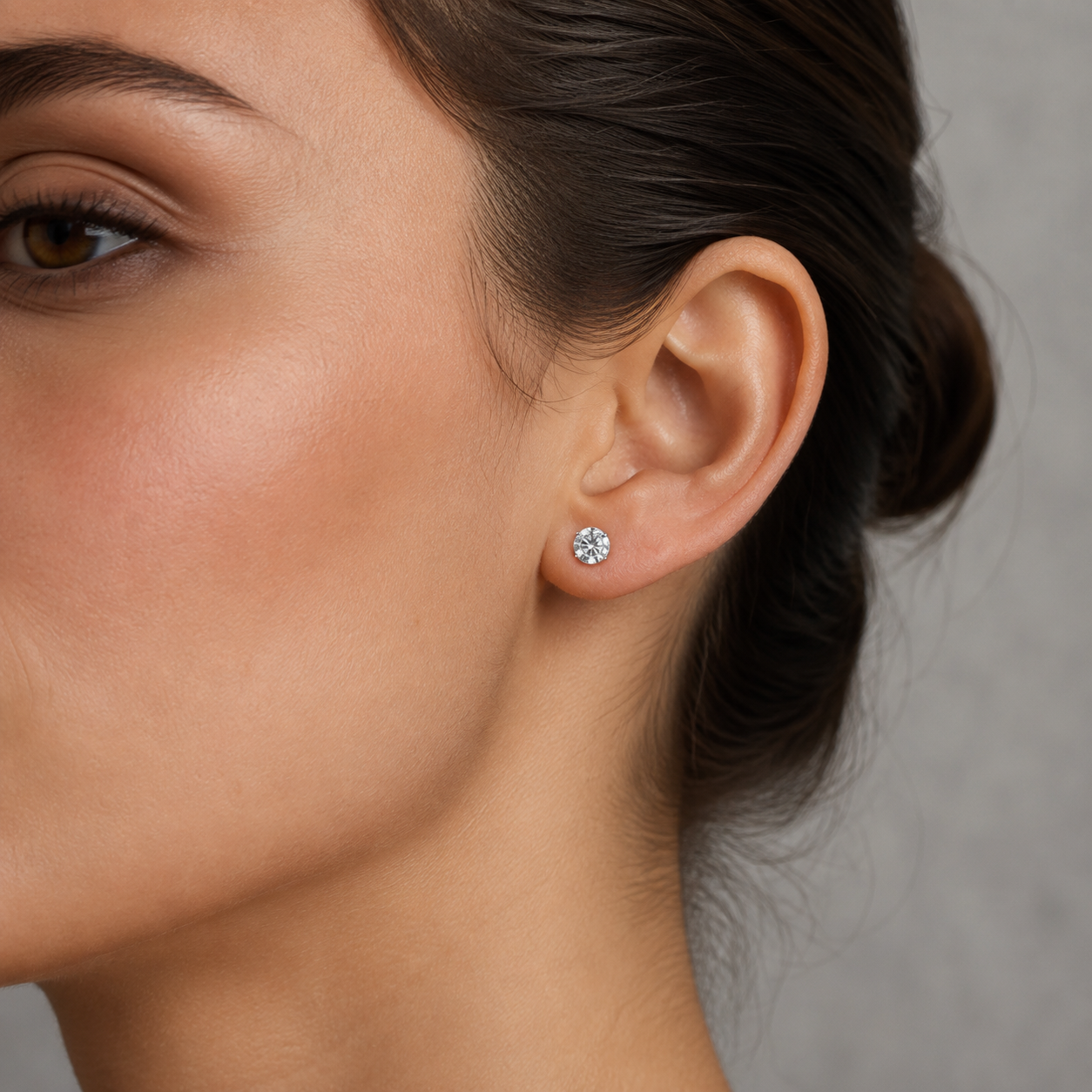 Classic lab grown diamond stud earrings in white gold worn on model
