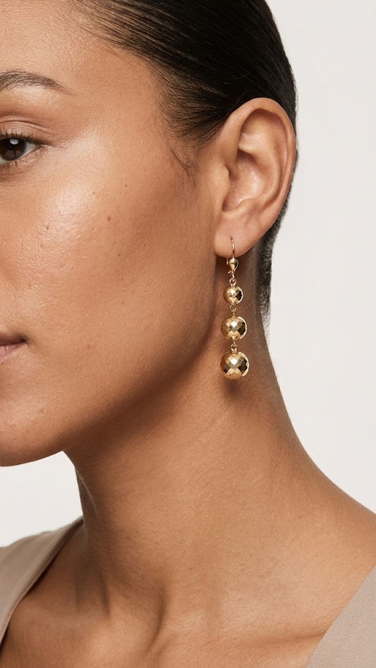 Della 9k yellow gold drop earrings worn on the ear, side profile, Luma Jewellery