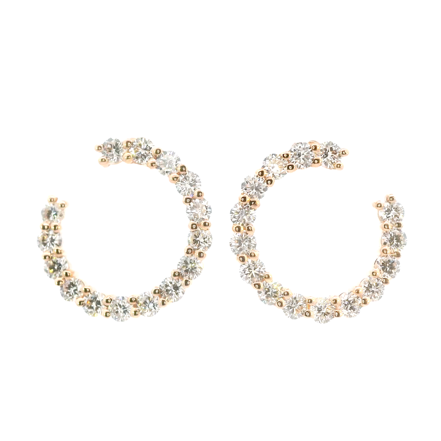 Pair of gold and silver hoop earrings on a white background