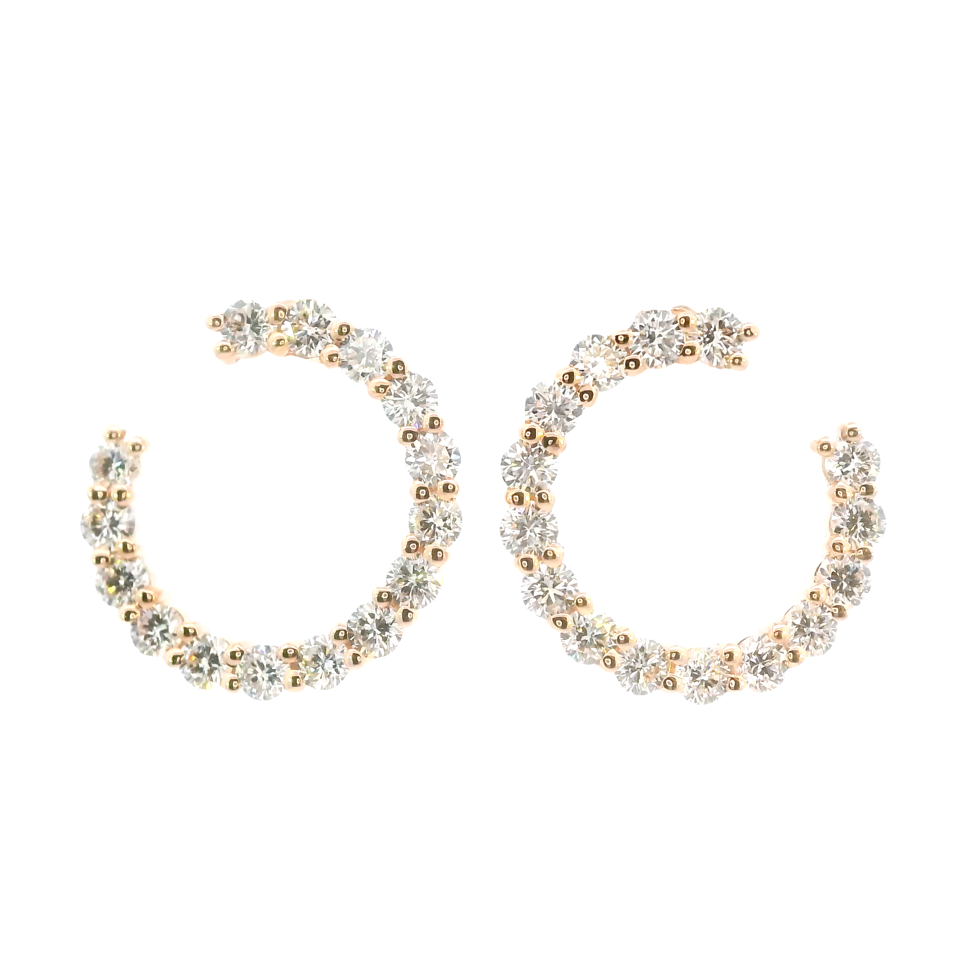 Pair of gold and silver hoop earrings on a white background