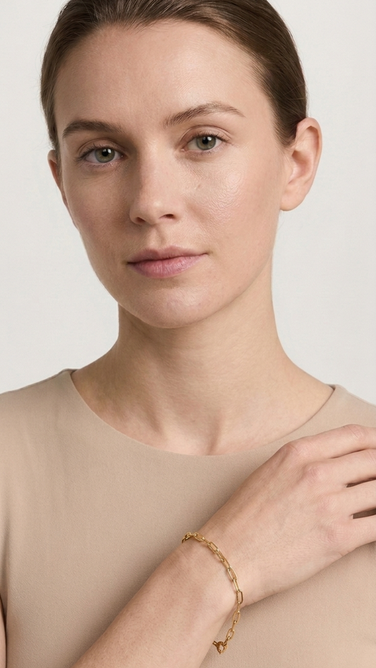 Elowen 9k yellow gold paperclip bracelet worn on the wrist, Luma Jewellery