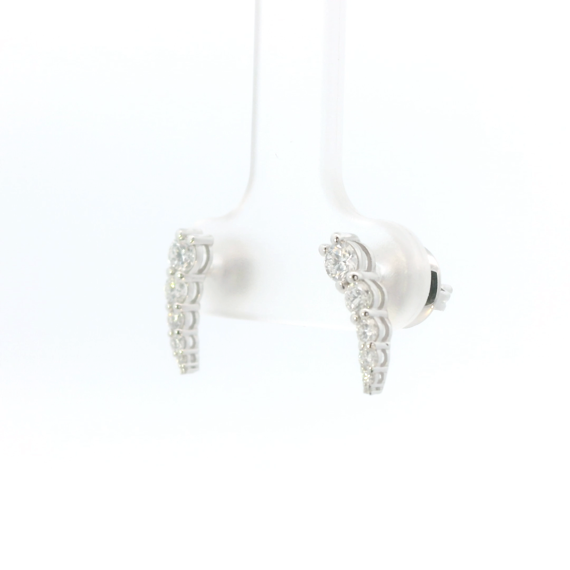 Pair of white earbuds with silver accents on a white background