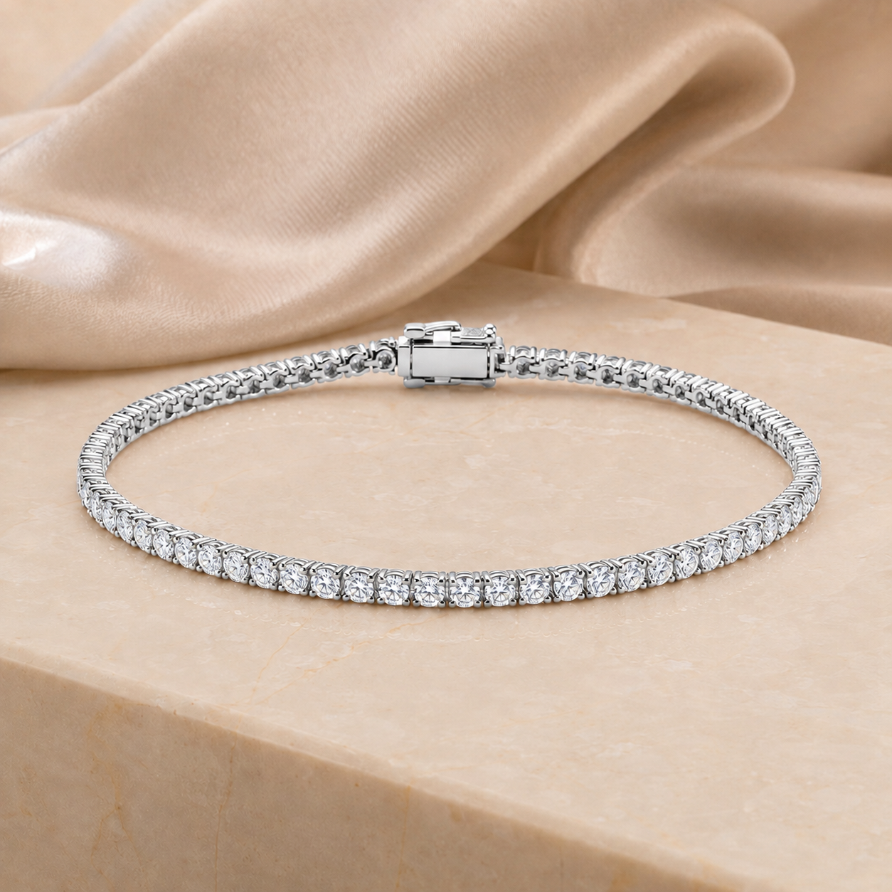 Isaline Fine Line 9k white gold lab grown diamond tennis bracelet on an ivory stone surface