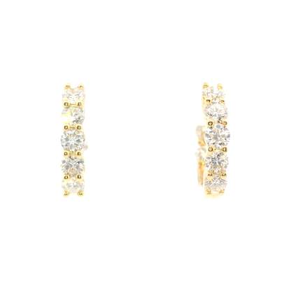 Gold hoop earrings with clear gemstones on a white background