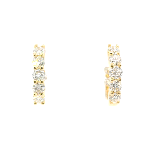 Gold hoop earrings with clear gemstones on a white background
