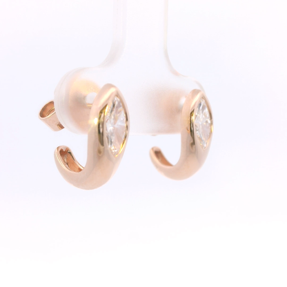 Rose gold hoop earrings with clear gemstones on a white background