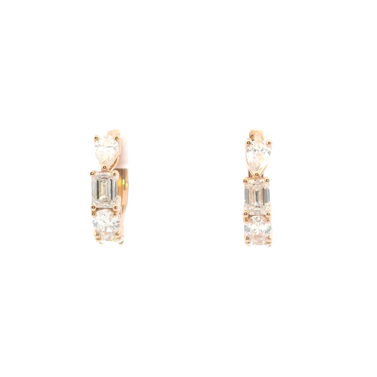 Pair of yellow gold earrings with clear gemstones on a white background