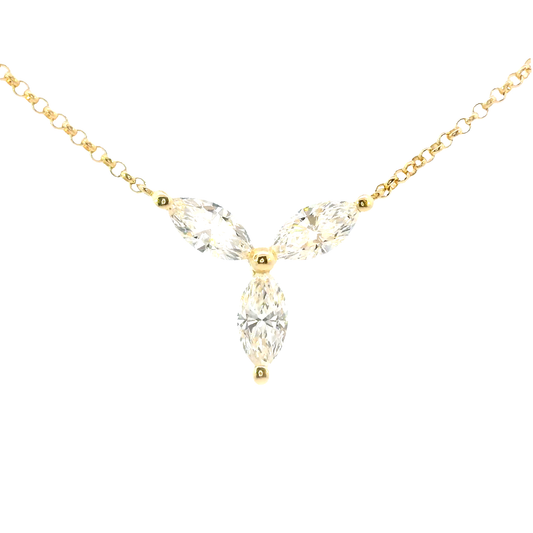 Gold necklace with a clear teardrop-shaped pendant on a white background
