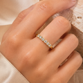 Ottilie 18k yellow gold round diamond half eternity ring worn on hand