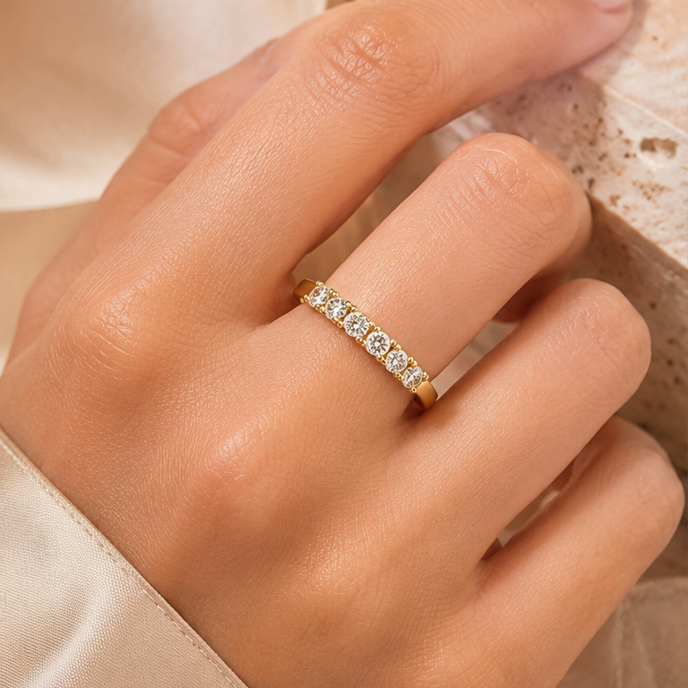 Ottilie 18k yellow gold round diamond half eternity ring worn on hand