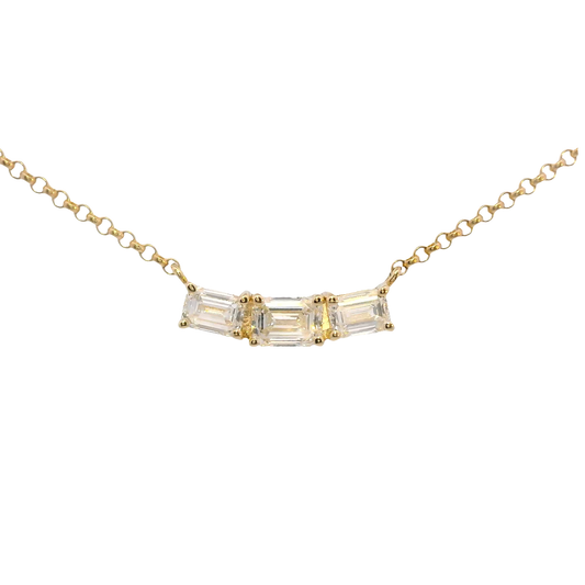 Gold necklace with baguette-cut diamonds on a white background