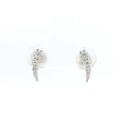 Pair of silver earrings with clear stones on a white background