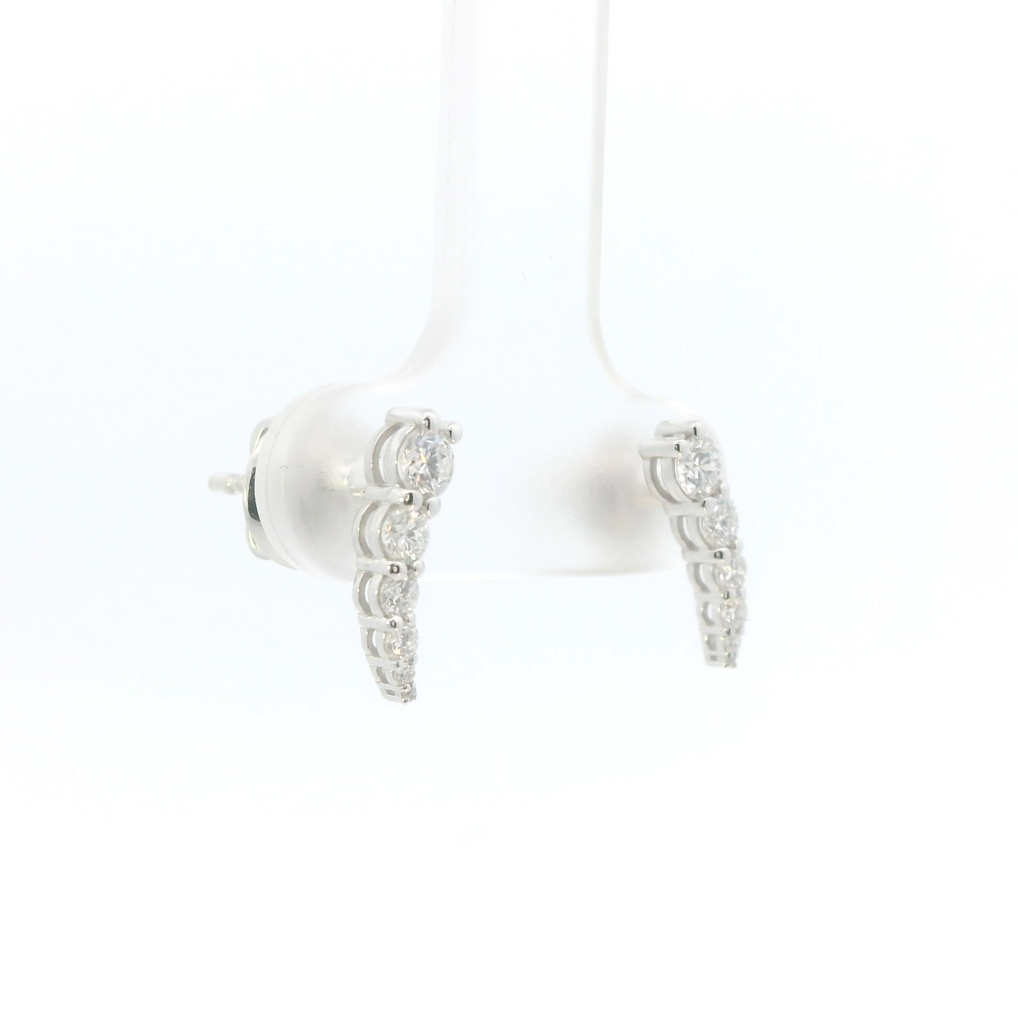 White earbuds with decorative silver accents on a white background
