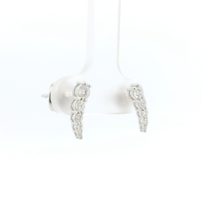 White earbuds with decorative silver accents on a white background